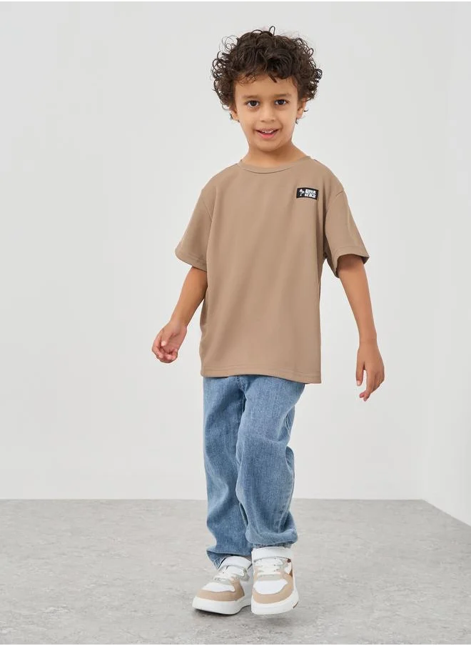 ستايلي Styli Textured Round Neck T-Shirt with Badge Detail