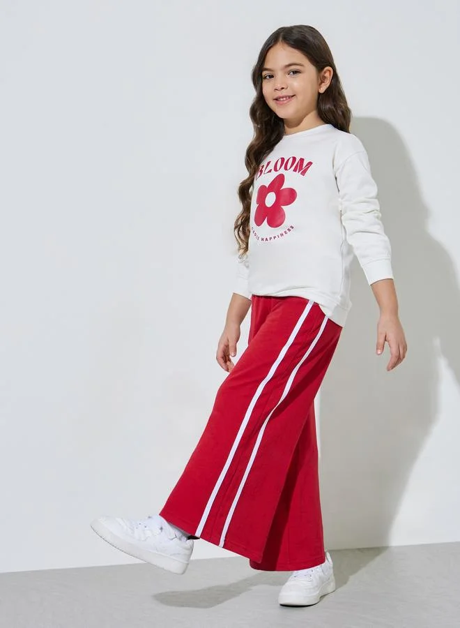Styli Girls Off White Graphic Print Sweatshirt and Red Side Striped Joggers Set