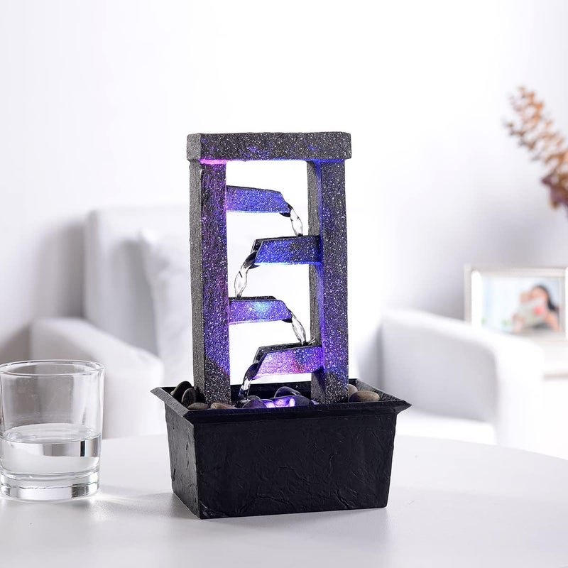 GOSSI 10" 4-Tier Tabletop Waterfall Fountain with Natural River Rocks & LED Lights, Indoor Water Fountain, Resin Desktop Water Feature for Home Office Decor, Meditation Relaxation Gift - Image 1