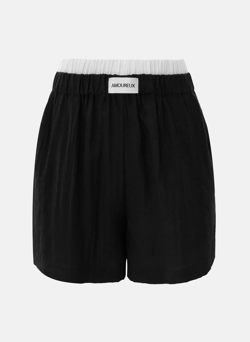 ليتشي شورت قصير فضفاض مع حزام خصر بلون متباين