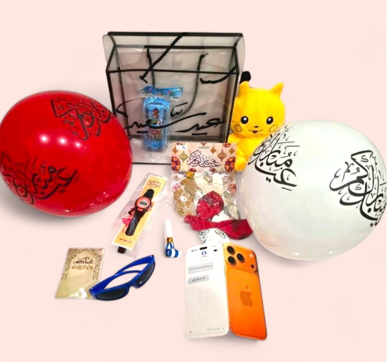 كريتر  صندوق هدايا عيد الفطر للأولاد بعبارة عيد سعيد - مجموعة كاملة للاحتفال بالعيد مكون من لعبة دمية بيكاتشو، إكسسوارات أطفال ممتعة (ساعة، نظارة، ألعاب تفاعلية)، بطاقة تهنئة بالعيد على شكل ايفون برو ماكس 17 ، مجموعة من البالونات برسومات العيد (عساكم من عواده)، سيارة اطفال. - Image 1