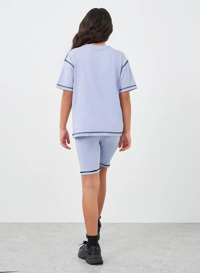 Styli Styli Girls Lilac Contrast Stitch Detail Oversized T-Shirt and Shorts Set
