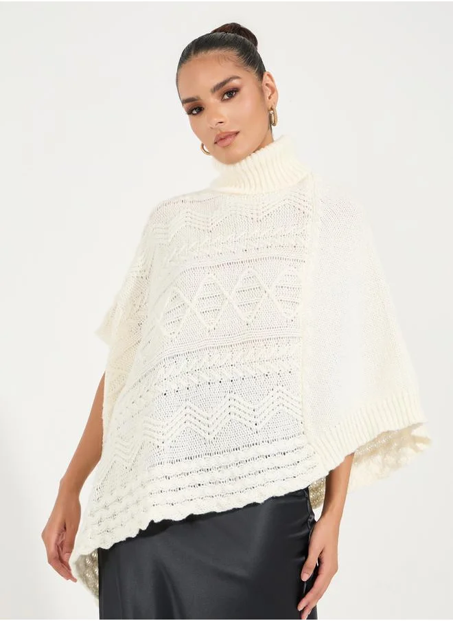 Styli Textured Knit Turtle Neck Sweater with Asymmetric Hem