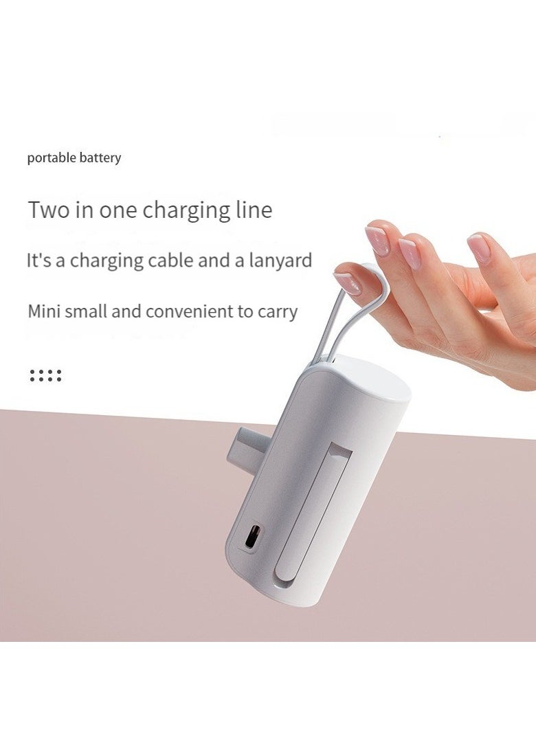 10000 mAh large capacity capsule power bank Typec plug and Apple cable double plug with built-in mobile phone holder portable multi-functional power bank white