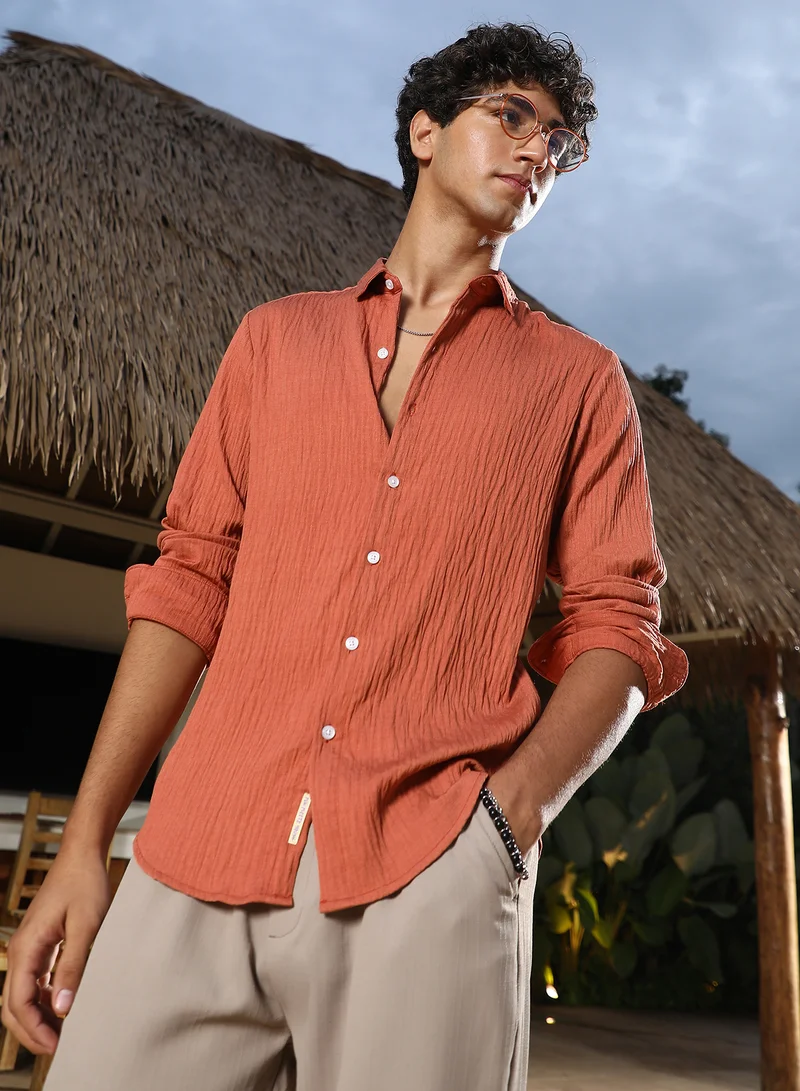 كامبوس سوترا Campus Sutra Men Solid Creased-Tactile Shirt | Spread Collar Long Cuffed Sleeves | Button Closure Curved Hem | Solid Creased | Woven Fabric For Casual & Daily Wear | Saffron Orange