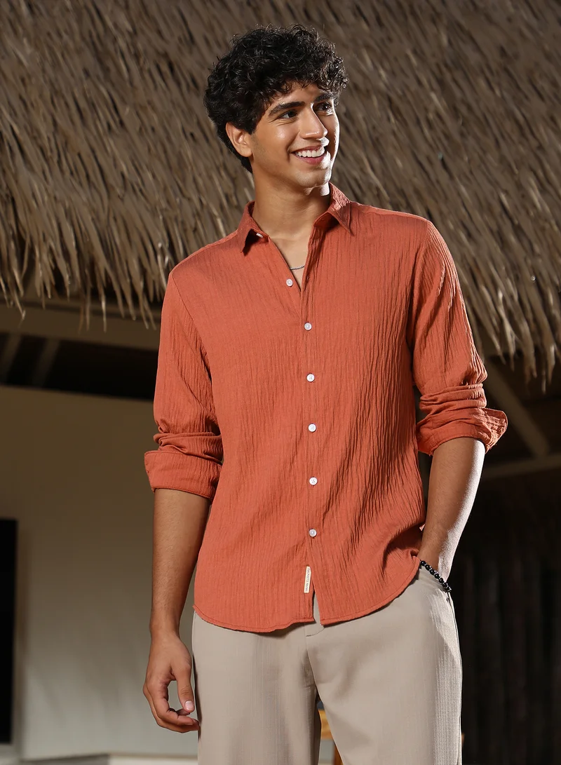 كامبوس سوترا Campus Sutra Men Solid Creased-Tactile Shirt | Spread Collar Long Cuffed Sleeves | Button Closure Curved Hem | Solid Creased | Woven Fabric For Casual & Daily Wear | Saffron Orange
