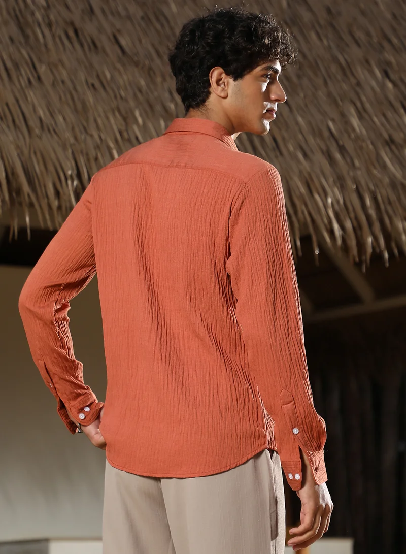 Campus Sutra Campus Sutra Men Solid Creased-Tactile Shirt | Spread Collar Long Cuffed Sleeves | Button Closure Curved Hem | Solid Creased | Woven Fabric For Casual & Daily Wear | Saffron Orange