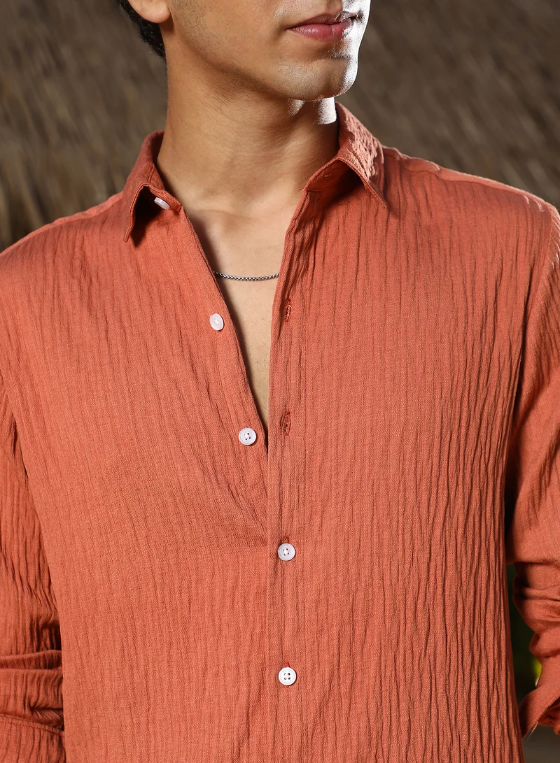 Campus Sutra Campus Sutra Men Solid Creased-Tactile Shirt | Spread Collar Long Cuffed Sleeves | Button Closure Curved Hem | Solid Creased | Woven Fabric For Casual & Daily Wear | Saffron Orange