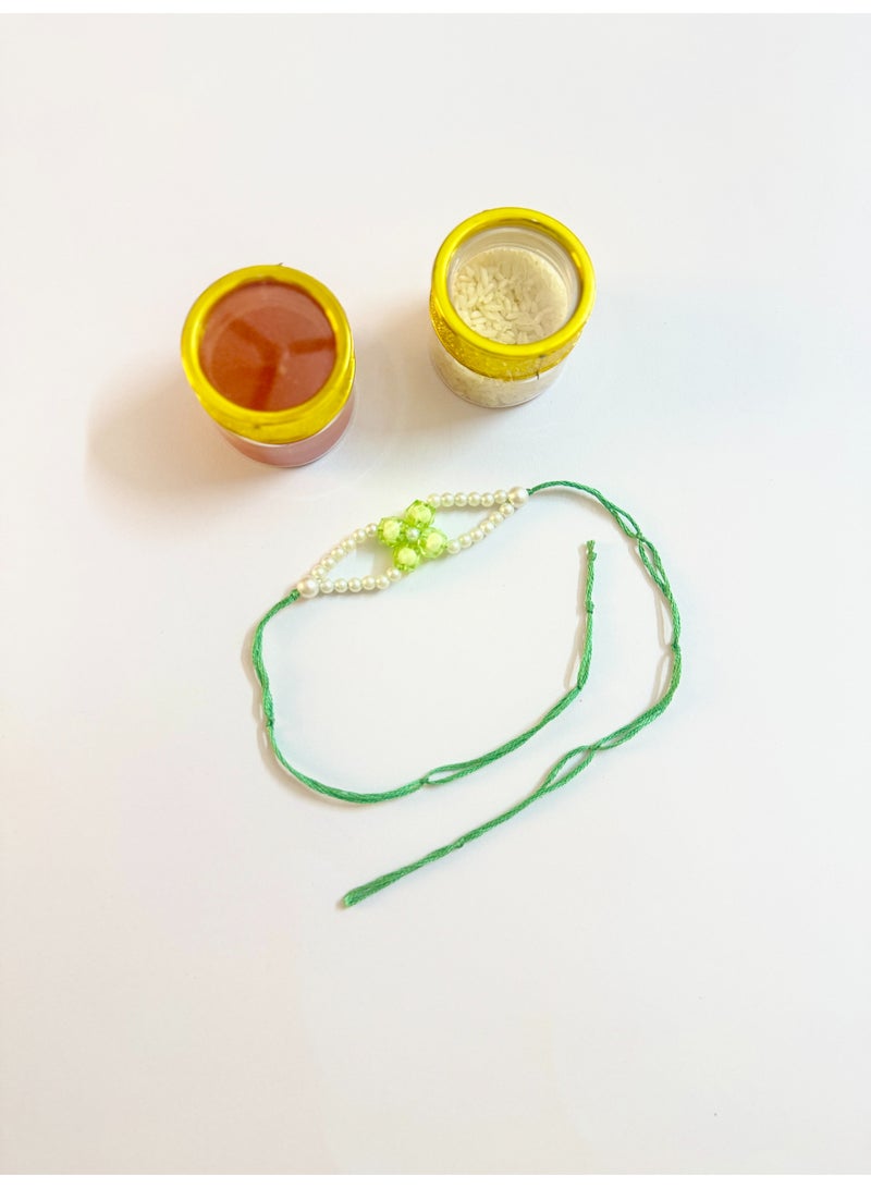 HerTouch Creations Handcrafted Green Floral Crystal Pearl Rakhi for Brother - Image 1