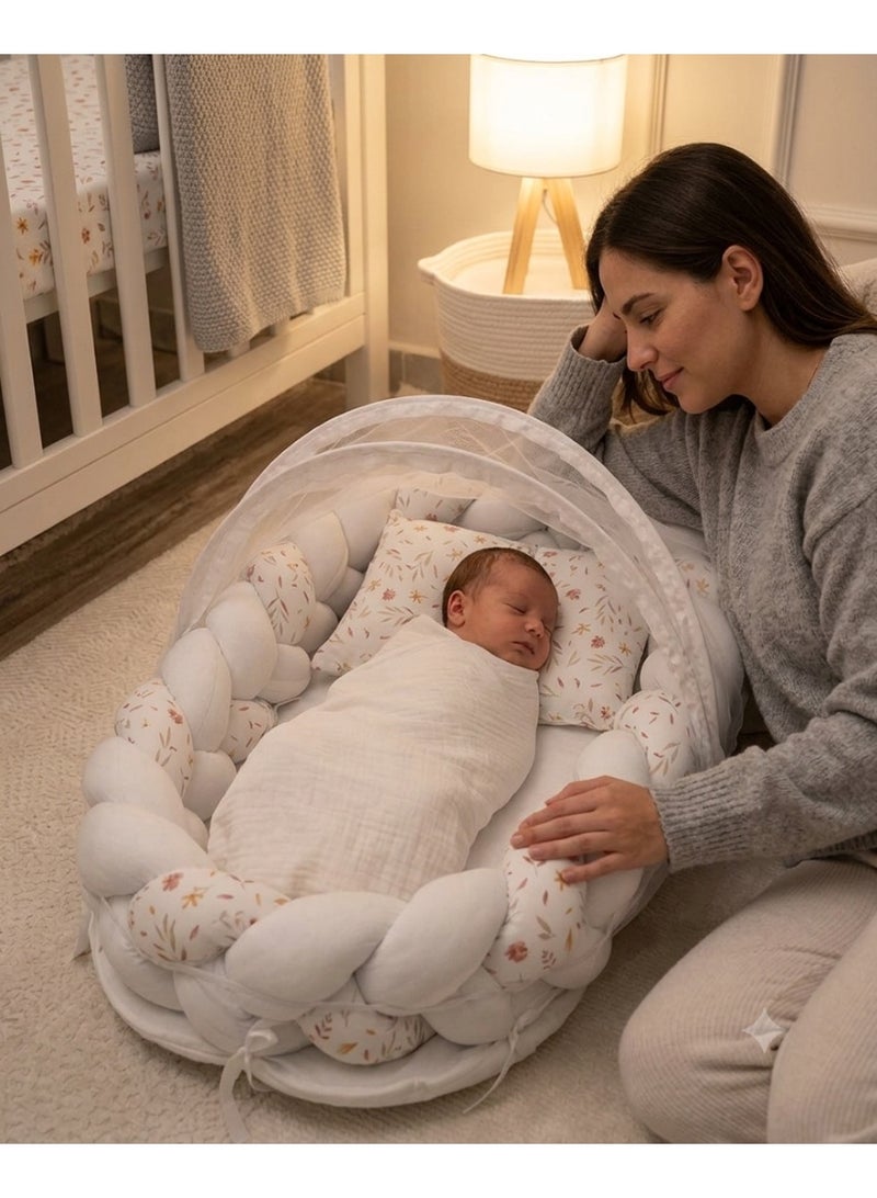StarKids A portable newborn bed featuring a cozy nest design, a braided protective bumper, and a detachable, built-in mosquito net, ensuring a peaceful, safe, and comfortable sleeping environment for your baby—anytime, anywhere. - Image 1