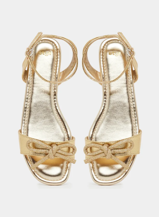 Styli Metallic Design Ankle Strap Flat Sandals