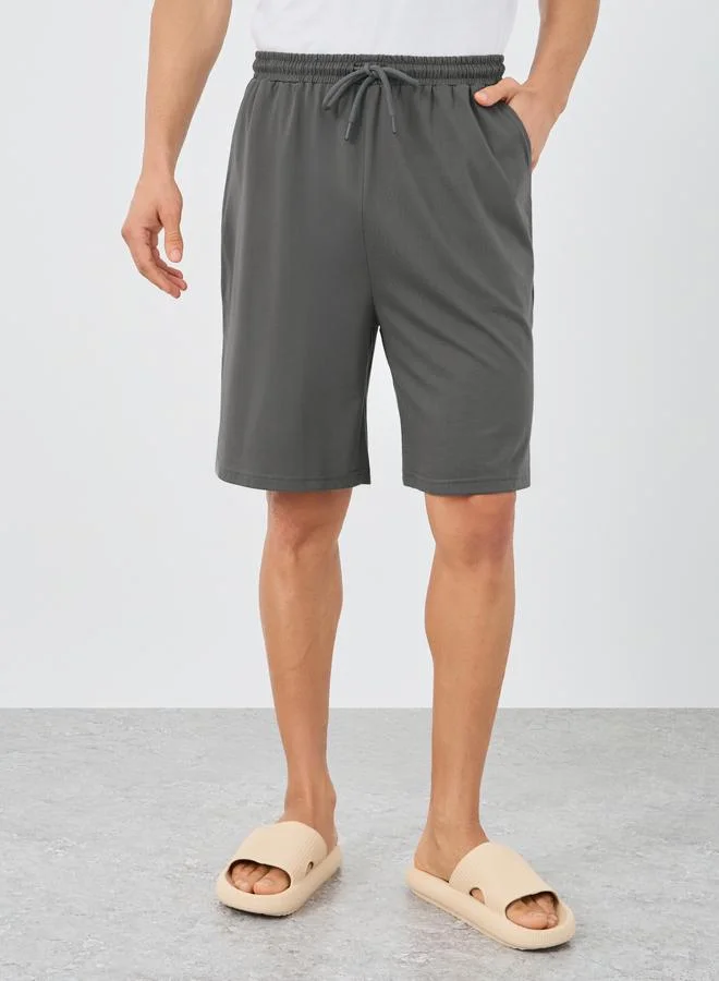 Styli Styli Textured Pleated Tapered Fit Trousers