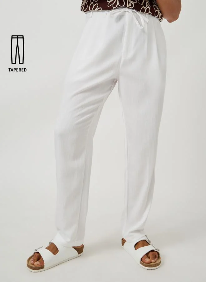 Styli Styli Textured Pleated Tapered Fit Trousers
