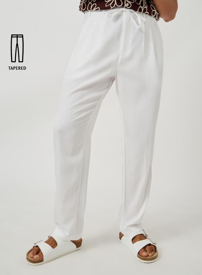 Styli Textured Pleated Tapered Fit Trousers - Image 1