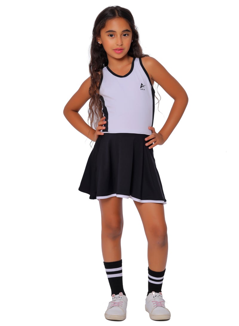 أنچا فستان رياضي باللونين الأبيض والأسود مع تنورة برتقالية للفتيات - Image 1