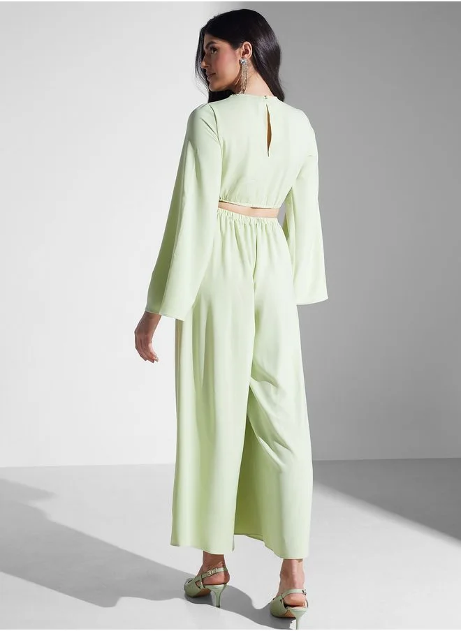 PRETTY LAVISH Flared Sleeve Belted Jumpsuit