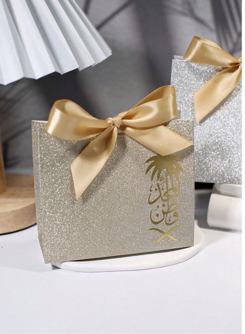 Saudi National Day Decorations - Gift Distribution 10 Gold Cardboard Boxes Decorated with a Gold Bow for National Day Distributions and Gifts - Image 1
