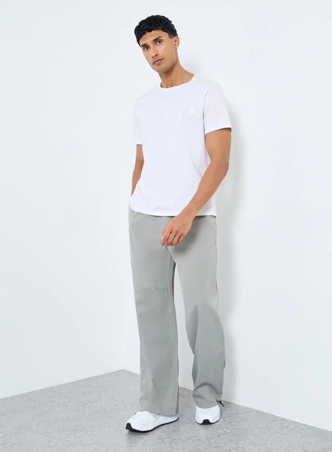 ستايلي Styli Men Baggy Panelled Open Hem Parachute Pants