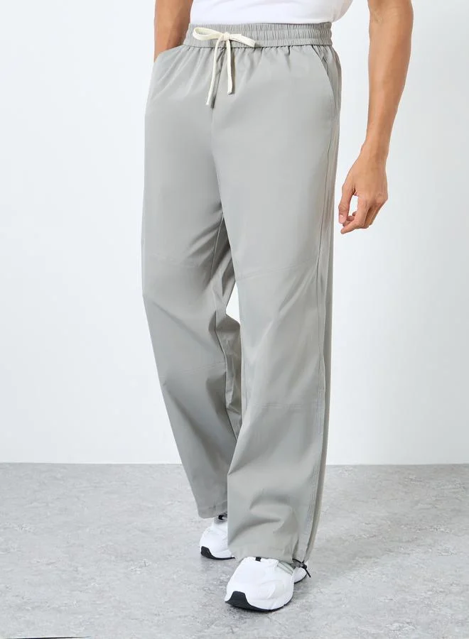 ستايلي Styli Men Baggy Panelled Open Hem Parachute Pants