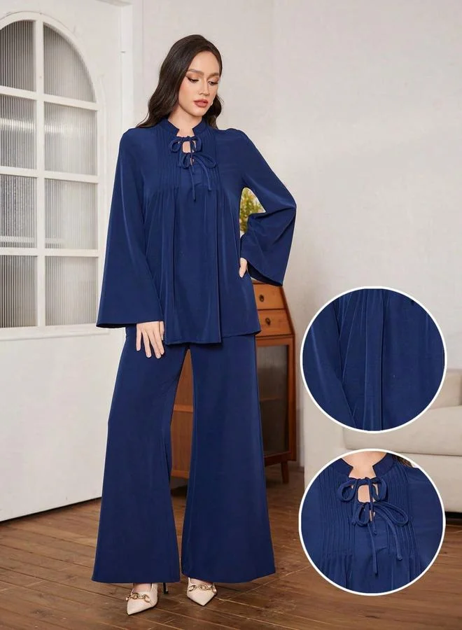 تايك تو طقم بلوزة كحلي بكشكشة وبنطال واسع