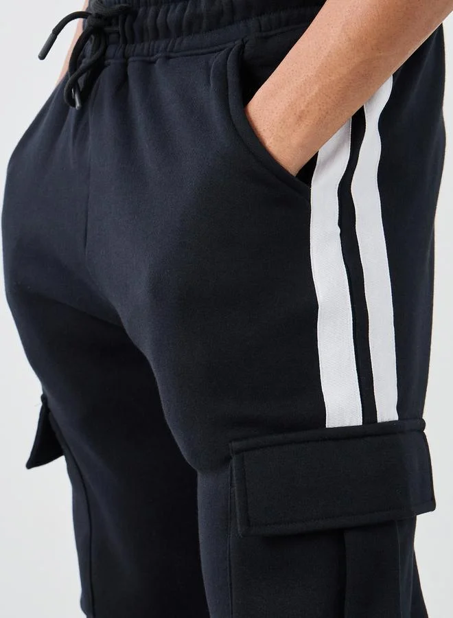 Styli Styli Side Twill Tape Oversized Joggers with Cargo Pockets Deatil