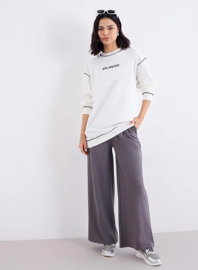 Styli Styli Off White Longline Embroidered Slogan Sweatshirt