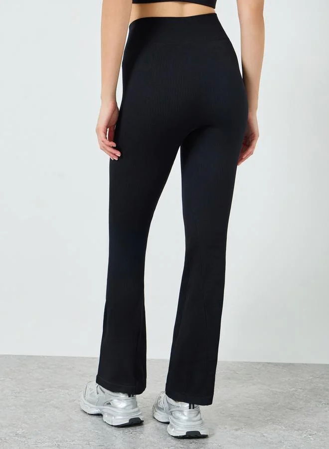 Styli Active  Black Solid Textured Flare Leggings for Women | Best Price UAE