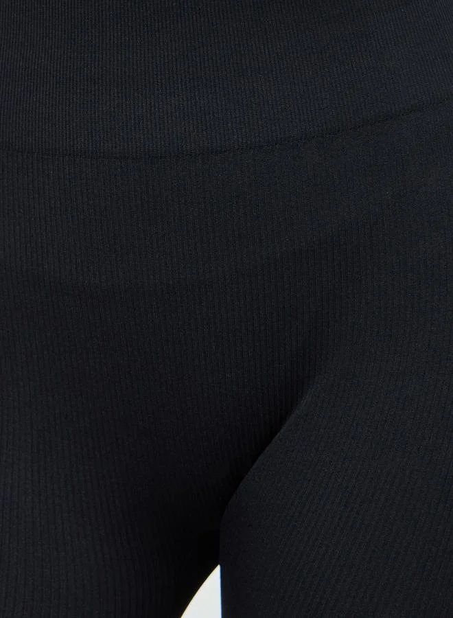 Styli Active  Black Solid Textured Flare Leggings for Women | Best Price UAE
