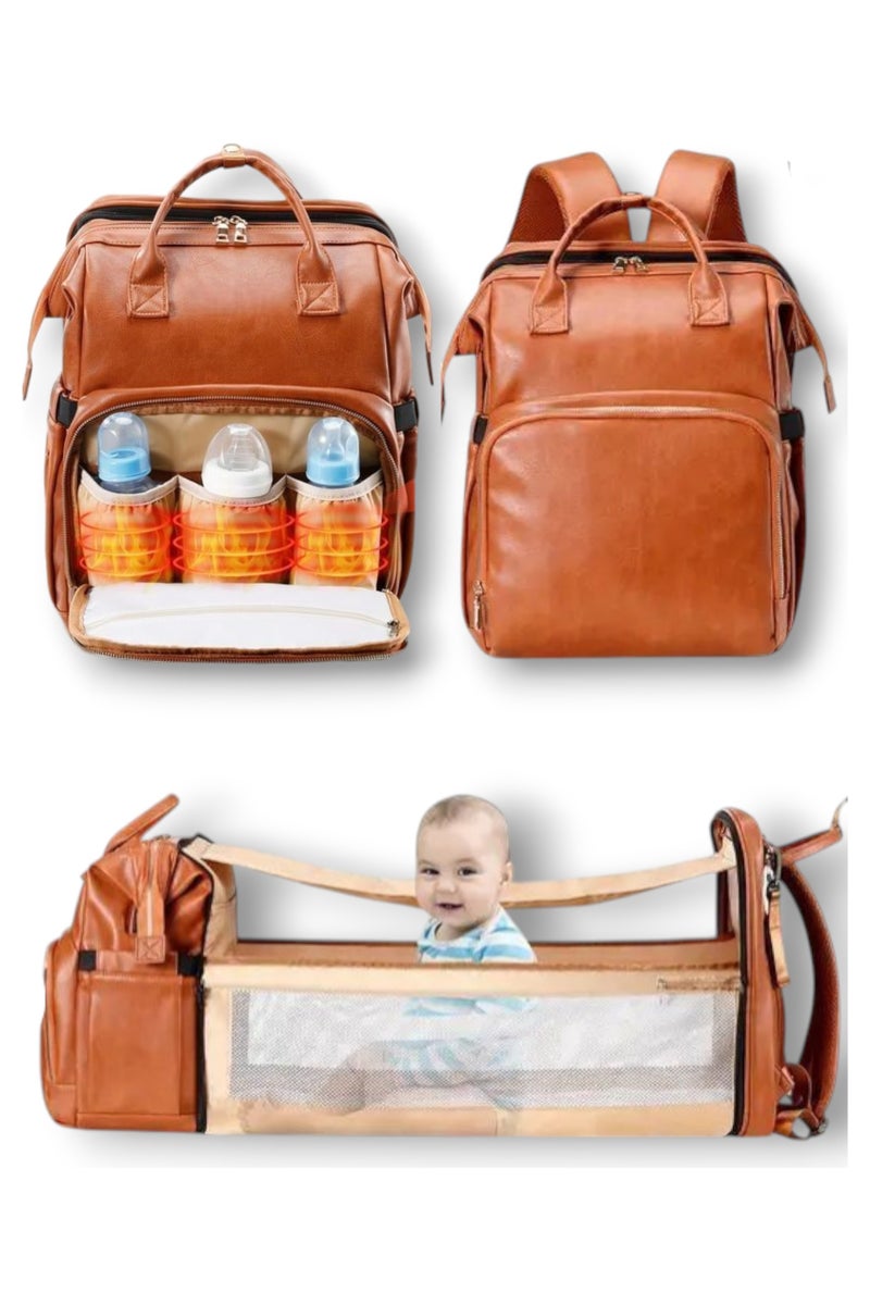 A special bag for newborn needs and equipment. It is a brown leather bag that is water-resistant, lightweight, and of high quality. It can be carried on the shoulder, hand, or back. It is multi-functional. You can open the bag to transform it into a crib for changing diapers or taking the baby to sleep. It also has a sun protection cover when needed. The bed is foldable and easy to assemble, so do not worry when going out about not having a room to change diapers. The bag is essential for working mothers or travelers. You need it when shopping, in the park, in public places, or when putting the baby in the nursery, for events, and for daily use. It has a large capacity and has 16 pockets, 3 pockets, and a holder for milk bottles. It is insulated with aluminum foil to maintain the temperature. It has two straps for hanging the bag on the stroller when outings so that the bag holder is not on your shoulder all the time. It can be an ideal gift for a mother and her newborn baby. - Image 1