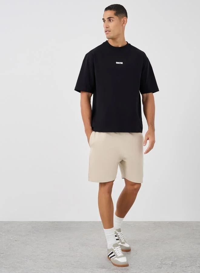 Styli Oversized Stretch Athleisure T-Shirt with Slogan Print