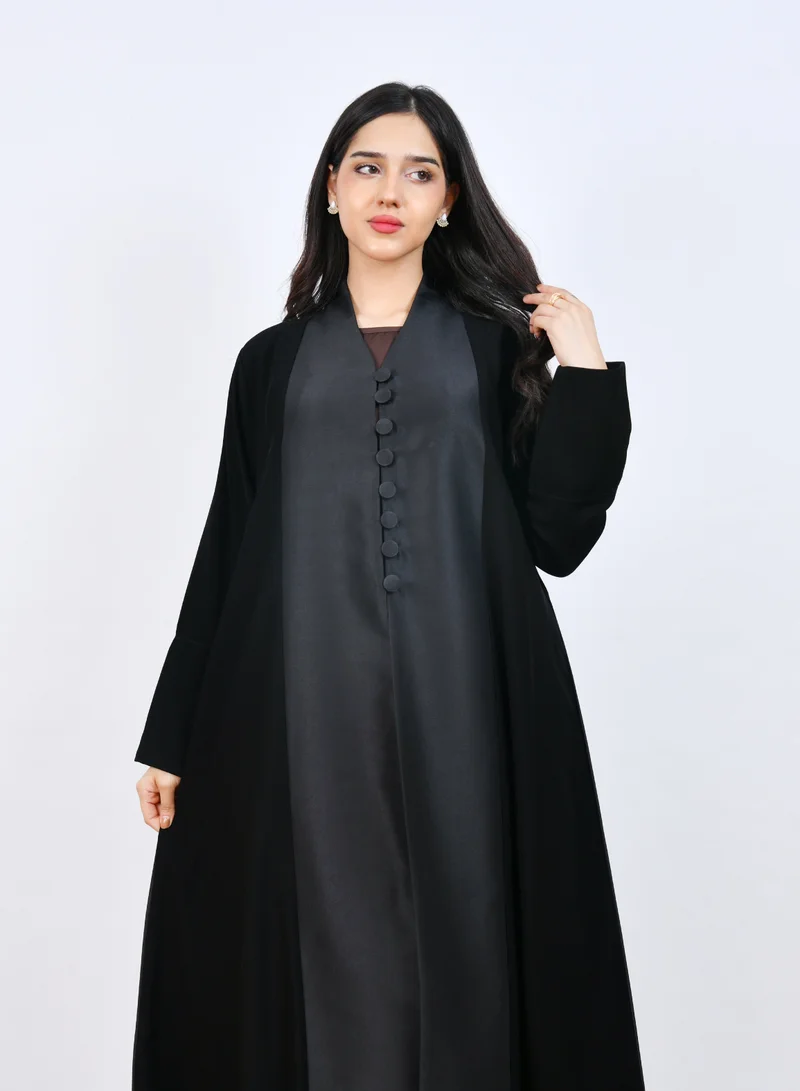 HAWRAA ABAYA Elegant Black Abaya with a classic design featuring front buttons and a half-cloche cut.