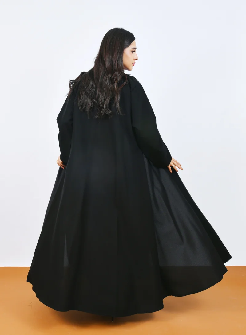 HAWRAA ABAYA Elegant Black Abaya with a classic design featuring front buttons and a half-cloche cut.