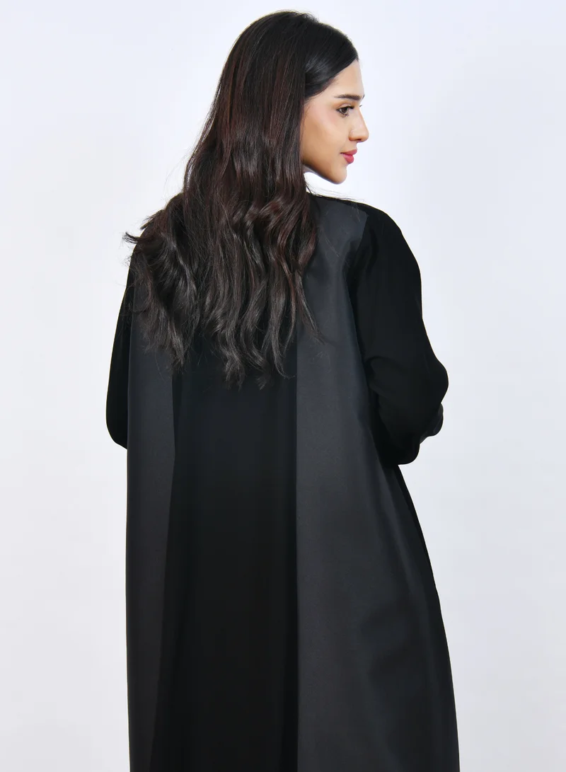 HAWRAA ABAYA Elegant Black Abaya with a classic design featuring front buttons and a half-cloche cut.