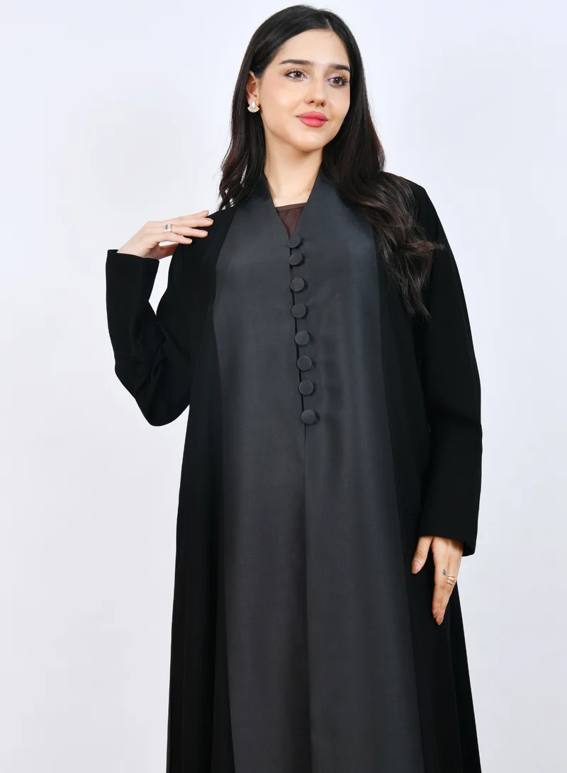 HAWRAA ABAYA Elegant Black Abaya with a classic design featuring front buttons and a half-cloche cut.