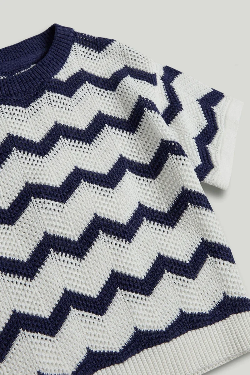 مذركير بلوزة محبوكة بلون أزرق داكن بتصميم موجة