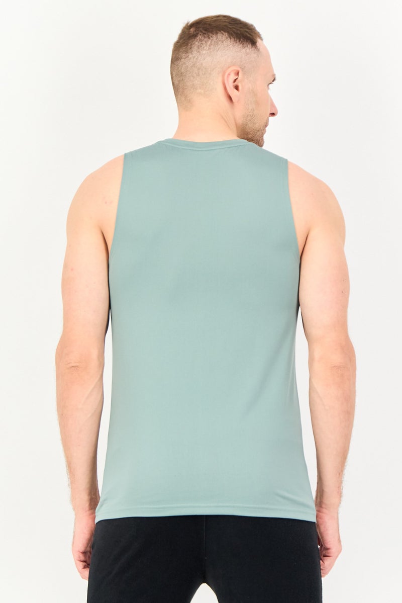 PUMA سترة تدريب أساسية بدون أكمام للرجال، لون أخضر حكيم - Image 4