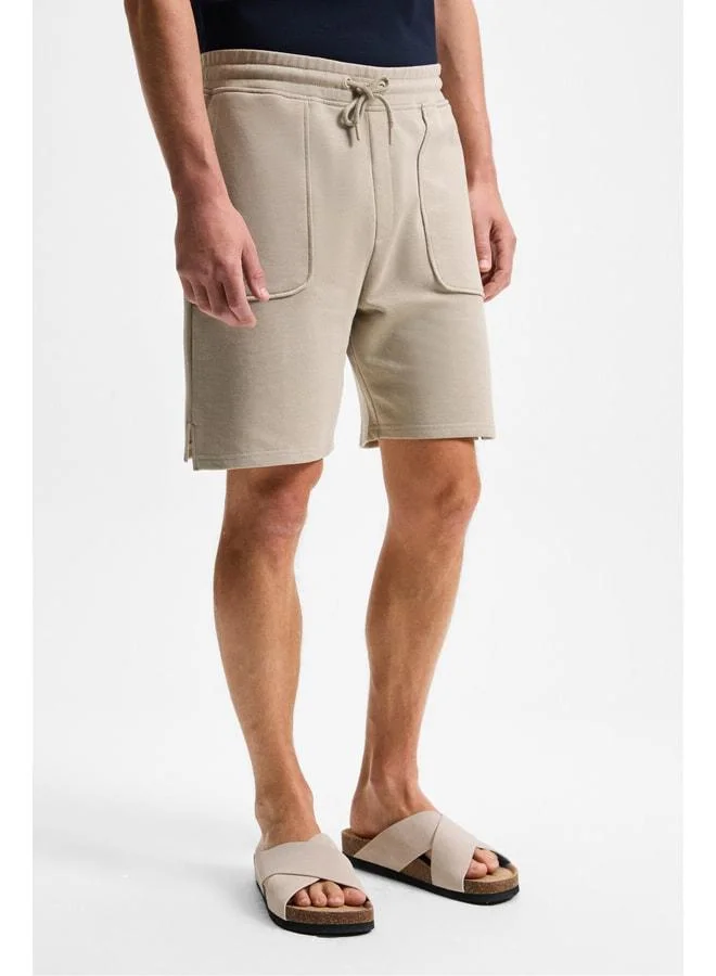 Grimelange GAUCI Men's Elastic Waist, Side and Back Pocket, Relaxed Stone-Colored Shorts.