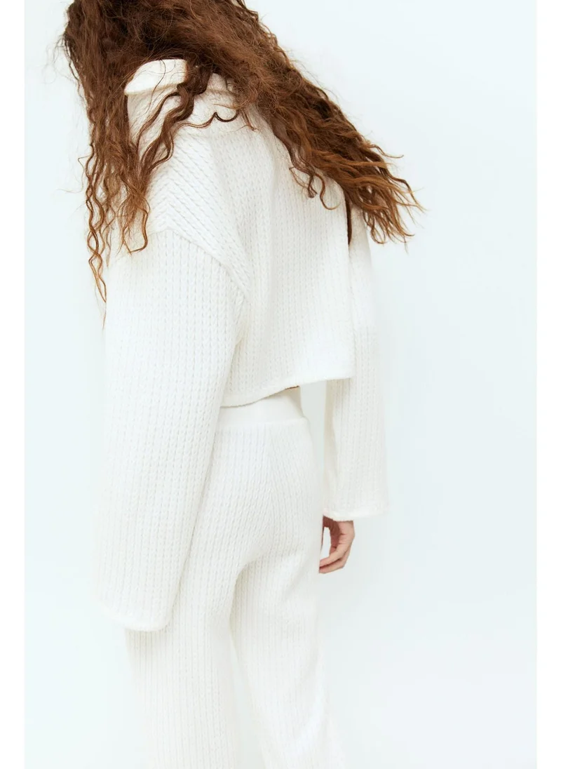 اتش اند ام Flared cable-knit look trousers