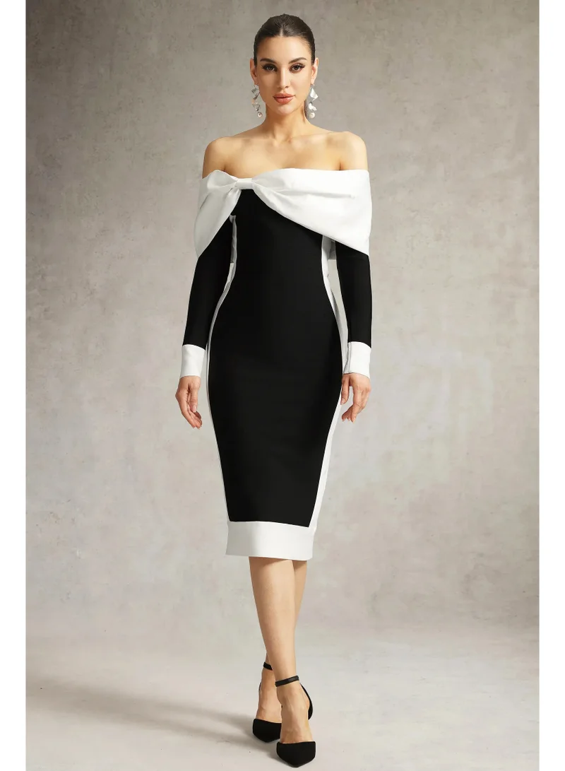 بيلا بارنيت فستان أوريا ميدي بكتفين مكشوفين وربطة فيونكة