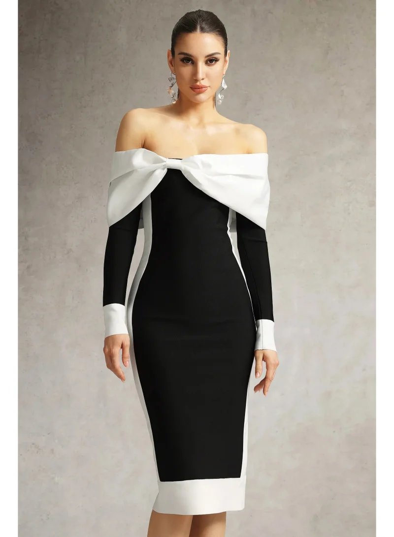 بيلا بارنيت فستان أوريا ميدي بكتفين مكشوفين وربطة فيونكة