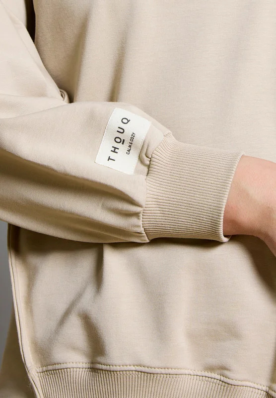 Thouq Asymmetric Hemline Extended Side Seam Sweatshirt