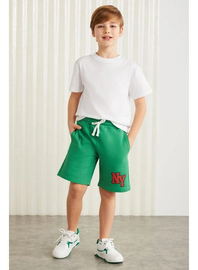 جريميلانج Darvell-grm24007 شورتات صبيان مطبوعة 100٪ قطن من Benetton باللون الأخضر.