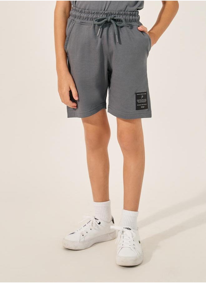 Styli Styli Badge Detail Short Sleeve T-Shirt and Shorts Co-Ords  - Image 4