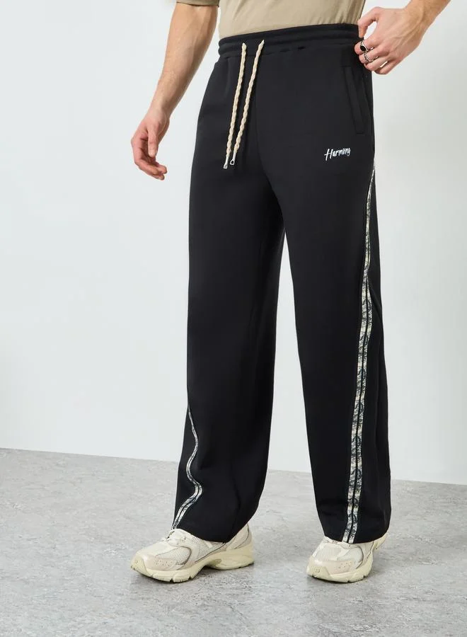 Styli Men Black Side Taping Print Oversized Joggers