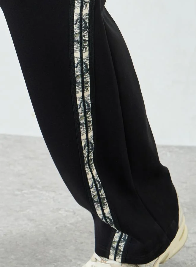 Styli  Styli Men Black Side Taping Print Oversized Joggers for Men | Best Price UAE