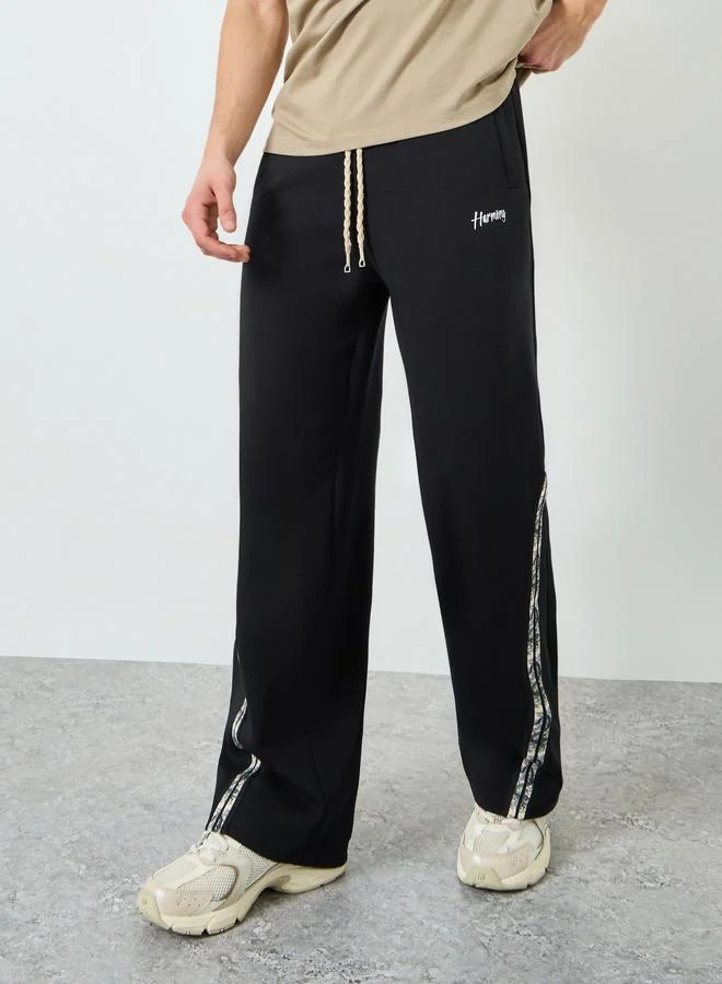 Styli  Styli Men Black Side Taping Print Oversized Joggers for Men | Best Price UAE