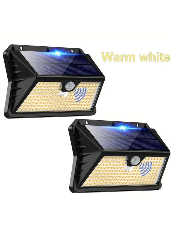 4 قطع مصابيح شمسية خارجية باللون الأبيض الدافئ مع حساس حركة IP65 - Image 2