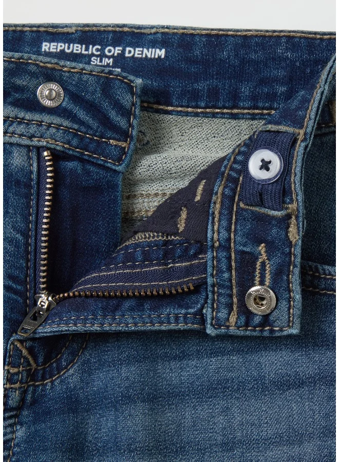 او في اس Jeans with five pockets and ''Sk8 & Sprayâ€ print