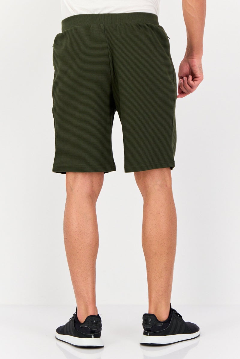 PUMA شورتات رياضية للرجال FIT في الهواء الطلق، زيتوني داكن - Image 3