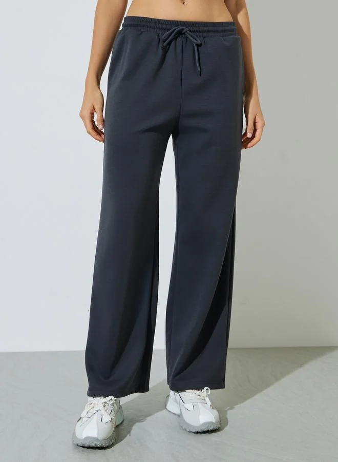 Styli  Charcoal Solid Round Neck T-Shirt and Joggers Co-ord Set for Women | Best Price UAE